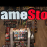 GameStop store sign above crowded retail space