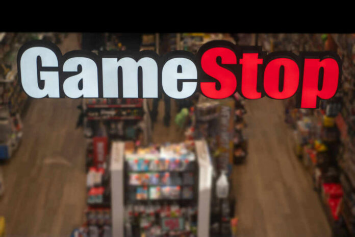 GameStop store sign above crowded retail space