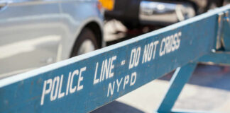 Blue NYPD barricade with Police Line - Do Not Cross.