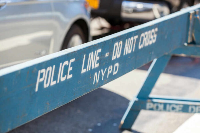 Blue NYPD barricade with Police Line - Do Not Cross.