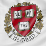 Harvard University crest on a white background