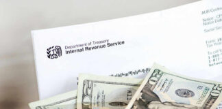 IRS letter with scattered U.S. dollar bills.
