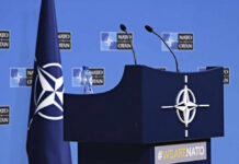 Russian Spy Planes Busted–NATO Strikes Fast! NATO podium with flags and microphones.
