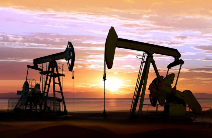 Oil pumps silhouetted against a sunset sky