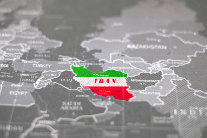 shutterstock_1666584235.jpg Map highlighting Iran with its national colors