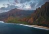 Helicopter Crash at Hawaii’s Remote Beach Aerial view of a rugged coastline with mountains and ocean waves