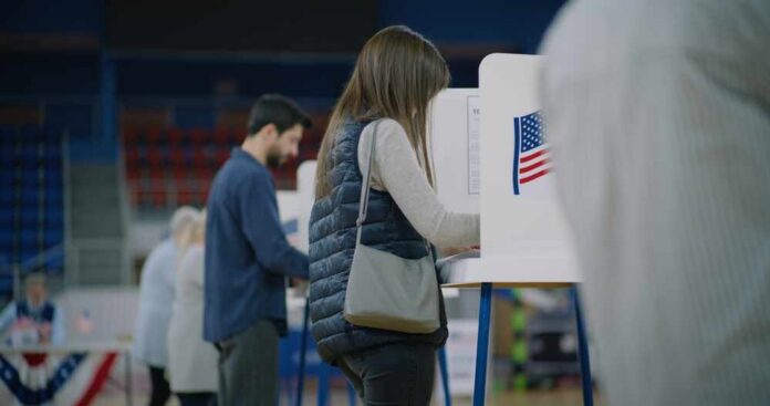 A person casting their vote at a polling station
