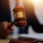Federal Court STUNS: Teens Go Down for Cartel Hit A gavel being struck on a desk in a courtroom setting