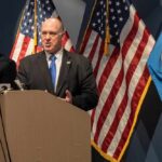 Border Czar UNLEASHES: Congress Betrayed ICE Government officials speaking at a press conference with U.S. flags in the background