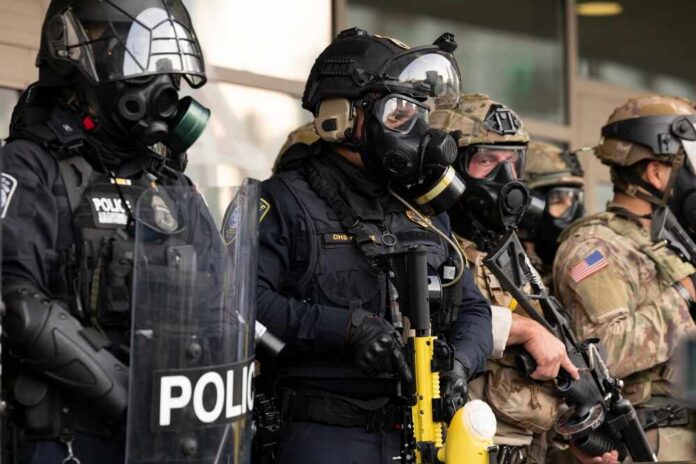 Police officers in tactical gear and gas masks standing in formation