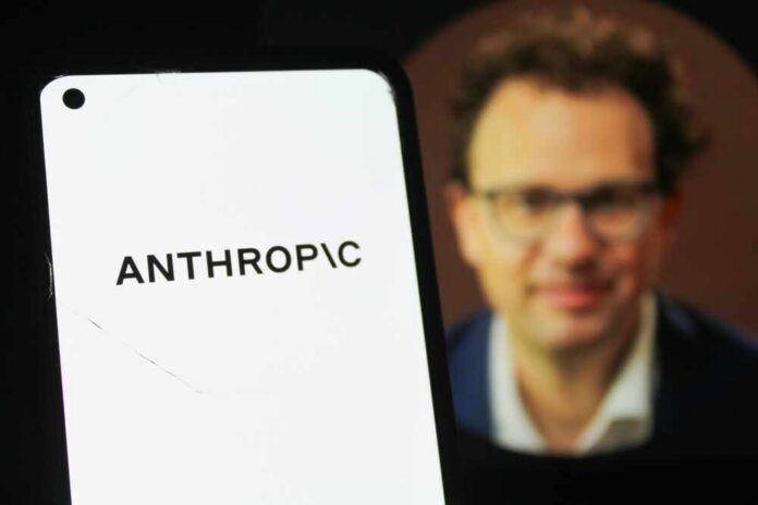 Close-up of a smartphone displaying the word 'ANTHROPIC' with a blurred portrait in the background