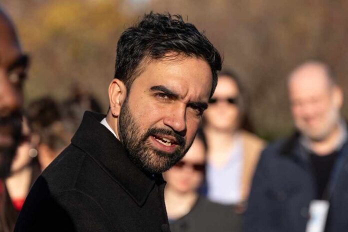 shutterstock_2706098681.jpg A man speaking passionately to a group of people outdoors