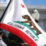California’s Controversial Map Survives—For Now California state flag being held up at an outdoor event