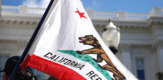 California state flag being held up at an outdoor event