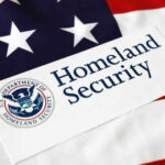 DHS Shutdown Chaos: Border Funding Targeted Homeland Security sign on American flag background