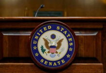 One “No” Vote TORCHES Career United States Senate emblem on wooden podium