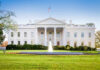 White House SLAMS Door on Immigration The White House with lawn and fountain.