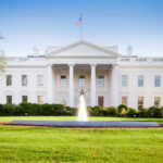 The White House with lawn and fountain.