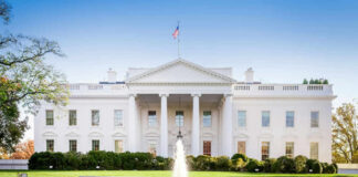 The White House with lawn and fountain.
