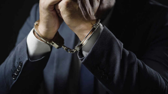 businessman-in-handcuffs-arrested2175831991jpg arrest