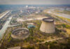 Nuclear power plant cooling towers and surrounding landscape