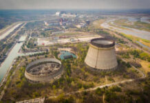 Nuclear power plant cooling towers and surrounding landscape