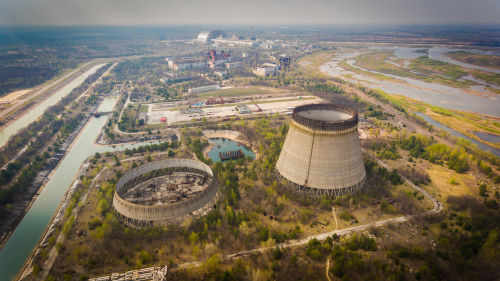 Nuclear power plant cooling towers and surrounding landscape
