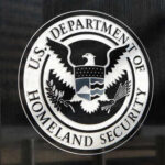 DHS BLASTS Media for Hiding Truth About Convicted Felon US Department of Homeland Security seal on building