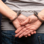 High-Profile Arrests: The Manhattan Protest Showdown Persons hands in handcuffs behind their back