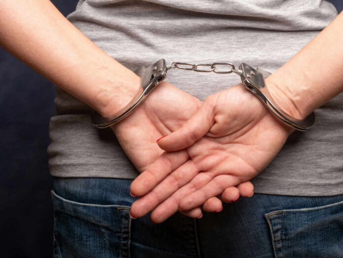 hands in handcuffs_1574123755.jpg Persons hands in handcuffs behind their back