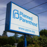 Planned Parenthood sign with website and logo displayed