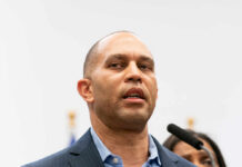 A government official speaking at a press conference
