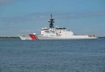A U.S. Coast Guard patrol vessel sailing on calm waters