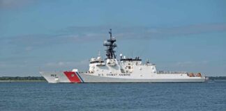 A U.S. Coast Guard patrol vessel sailing on calm waters