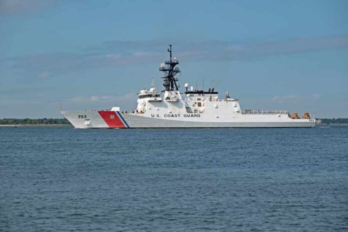 A U.S. Coast Guard patrol vessel sailing on calm waters
