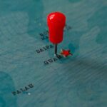 China’s Cable-Cutting Power: Guam’s Vulnerable Strands Red pin marking Guam on a blue map