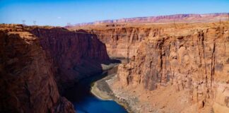 A scenic view of a canyon with a river flowing through it