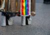 Close-up of glittery high heels and colorful fabric at a pride event