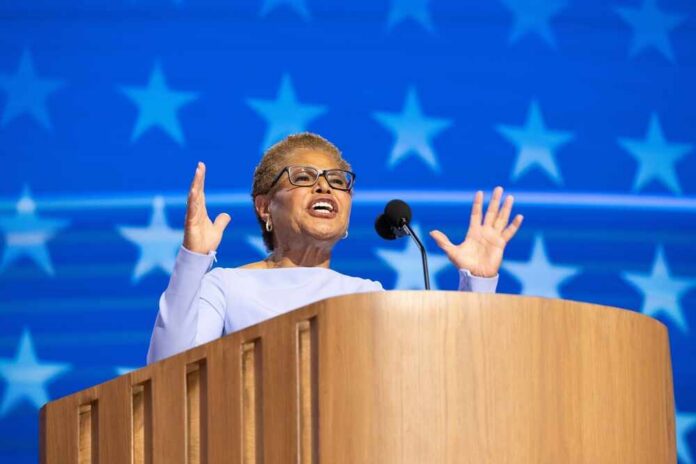 A female speaker passionately addressing an audience from a podium