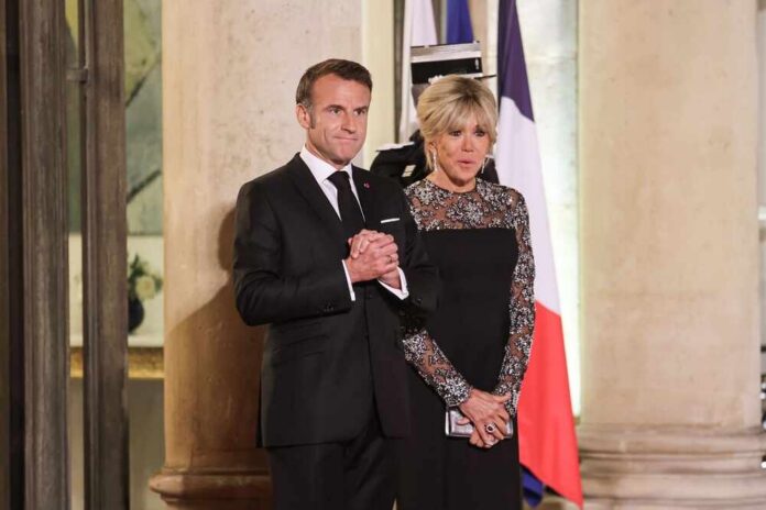 shutterstock_2533880725.jpg A couple dressed in formal attire at a ceremonial event