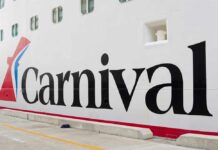 Close-up of the Carnival cruise ship logo on its hull