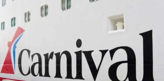 Close-up of the Carnival cruise ship logo on its hull