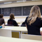 Teen Substitute ARRESTED — Murder Plot at School Students seated in a classroom listening to a teacher