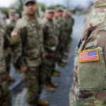 Pentagon’s SHOCK Move: Troop Deployment HALTED! Military personnel standing in formation outdoors