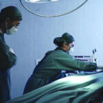 27-Year-Old Dies During BBL — Clinic Has Prior Fatality Surgeons performing operation in hospital operating room.