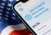 Phone screen displaying Democratic National Committee website.