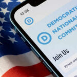 Blue Wave COLLAPSES — Deceptive New Battlefield EXPOSED Phone screen displaying Democratic National Committee website.