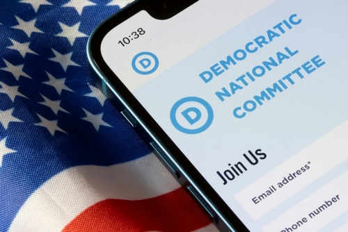 Phone screen displaying Democratic National Committee website.