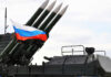 Radioactive Threat? Depleted Uranium FOUND in Russian Missiles Military launcher with four missiles and Russian flag