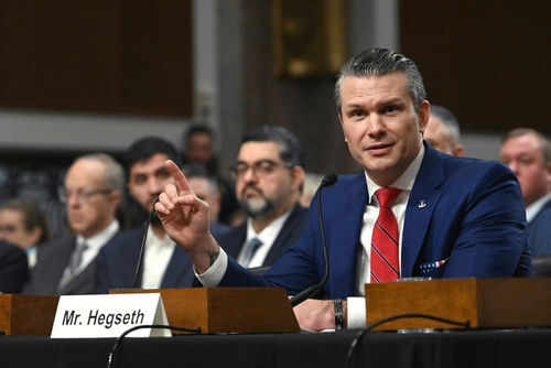 Person speaking at a conference meeting with microphone